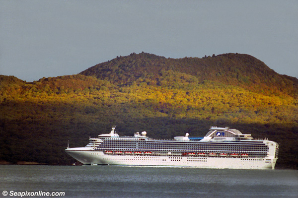 SAPPHIRE PRINCESS (2004/115875grt/IMO 9228186) passing beneath the cone of volcanic Rangitoto Island, as she sails from Auckland, New Zealand at the close of her 2004/5 season of cruises out of the port. She is the largest passenger vessel to visit Australasia as at the date of this picture. 23 February 2005. Photo by SeapixOnline.com